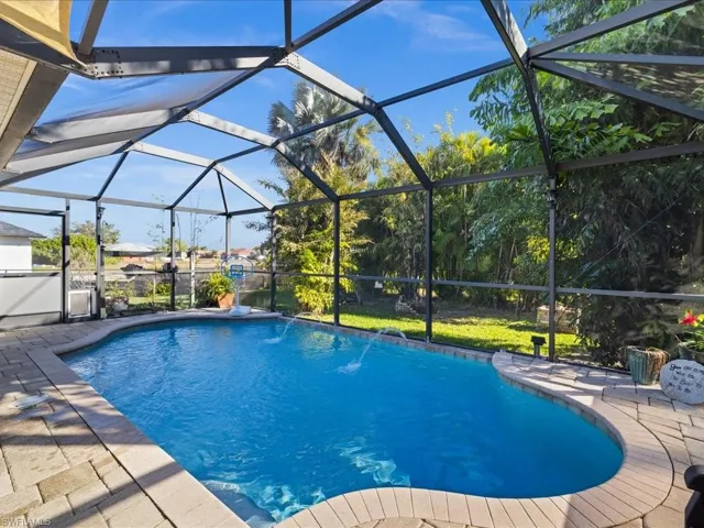 Swimming pool with glass enclosure and a sunroom