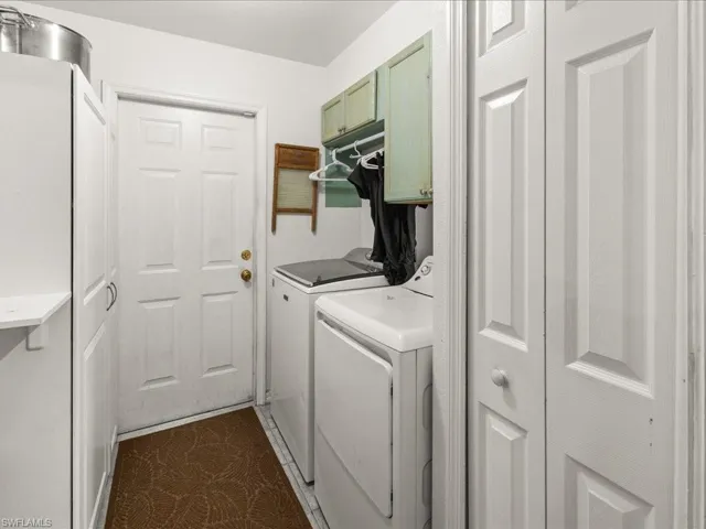 Laundry area with washer and dryer and cabinet space