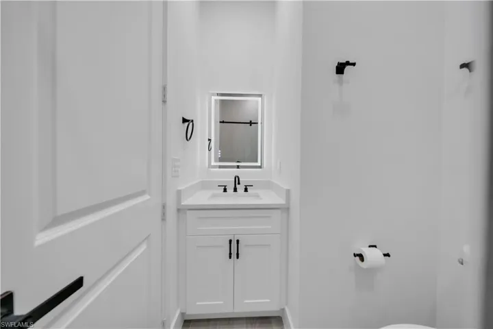 Bathroom with vanity and a shower