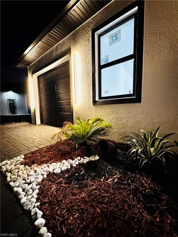 View of side of home with stucco siding