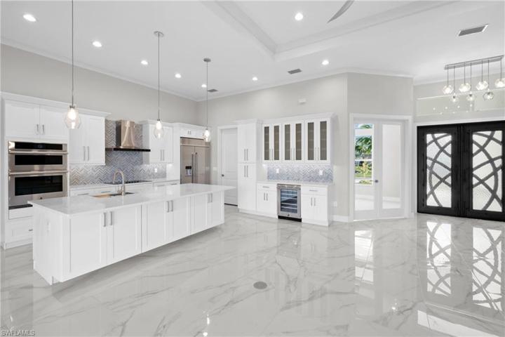 Side bar with wind fridge off kitchen ..glass doors to the right go to the den