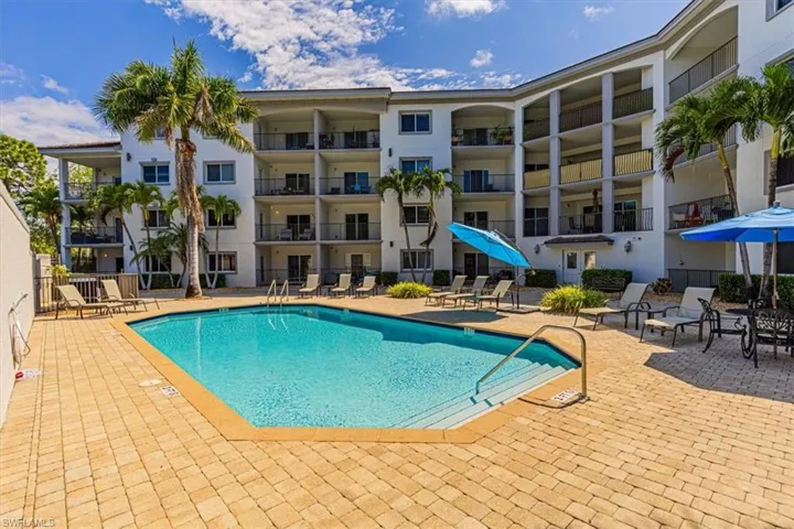 Community pool with a patio area