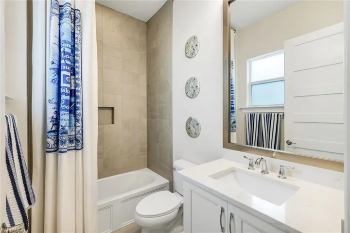 Full bathroom with vanity and shower / bath combo