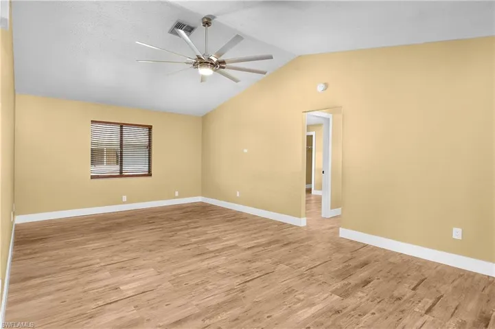 Spare room with light wood-style flooring and ceiling fan