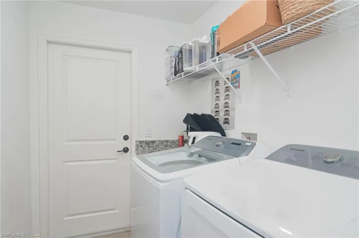 Washroom featuring washing machine and dryer