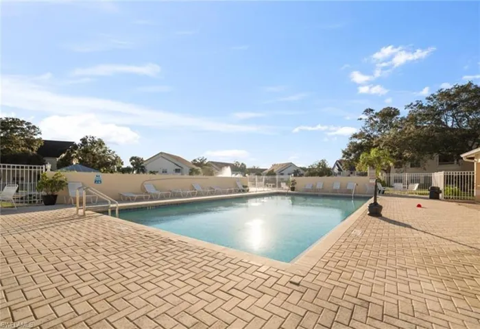 Community pool featuring a patio area