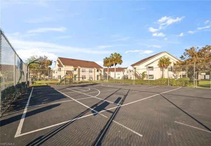 View of sport court featuring community basketball court and a residential view