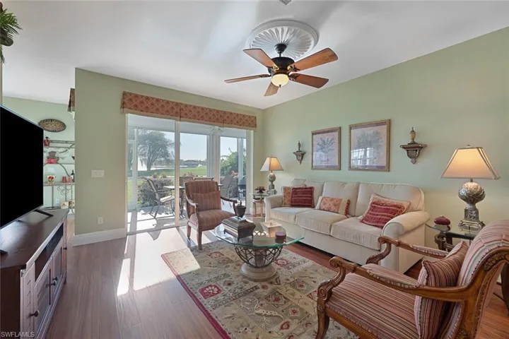 Living room featuring wood finished floors and a ceiling fan