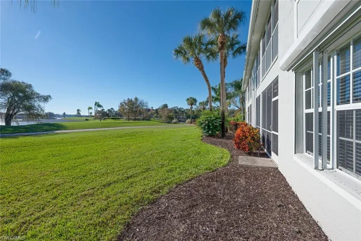 View of grassy yard featuring view of golf course