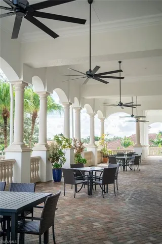 View of patio featuring outdoor dining space and ceiling fan