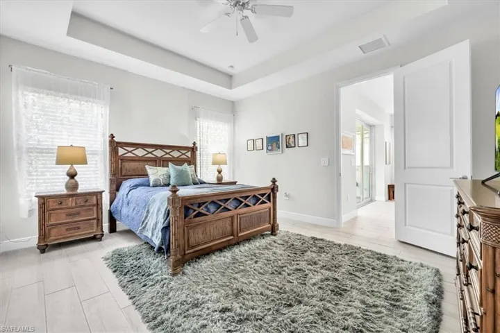 Recessed ceiling with a white ceiling fan and light kit