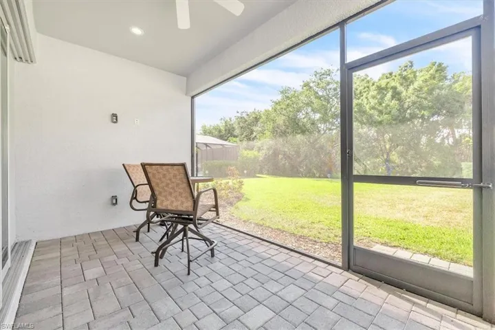 Screened patio featuring paver flooring, recessed lighting, and a ceiling fan
