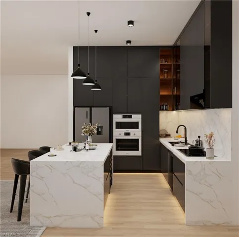 Kitchen with modern cabinets, light wood-style flooring, stainless steel refrigerator with ice dispenser, and light stone countertops (Rendered photo)
