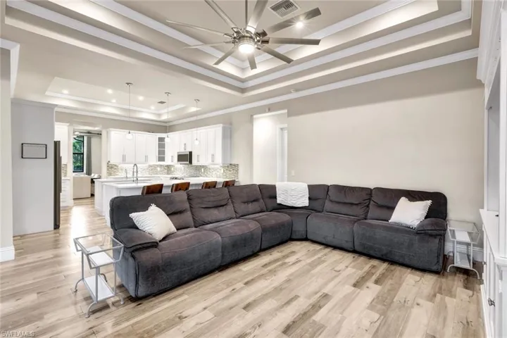 Living room and kitchen are open to one another.