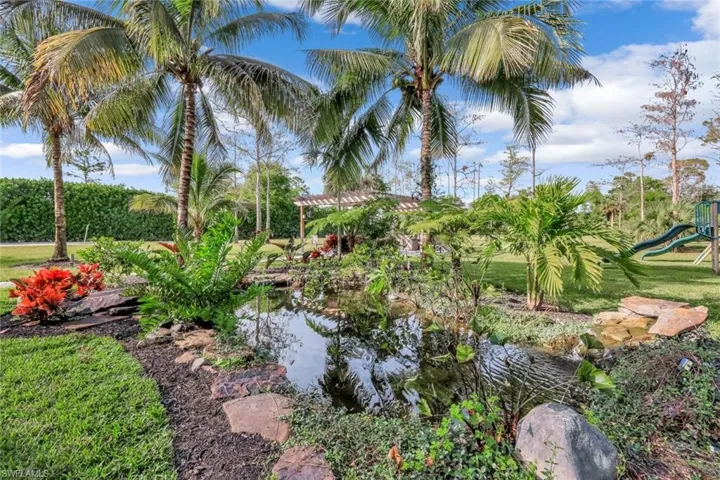 Featuring a 3,500 gallon coy pond surrounded by lush landscaping.