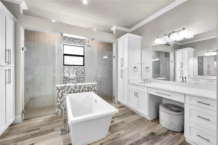 Ensuite primary bath features dual shower heads AND a large soaking tub.