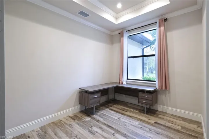 Den/office space is located off the formal living area