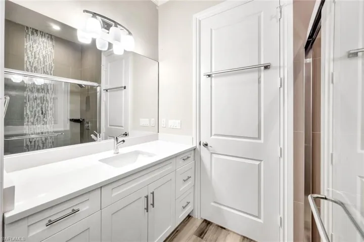 Guest bathroom offers a walk-in shower.