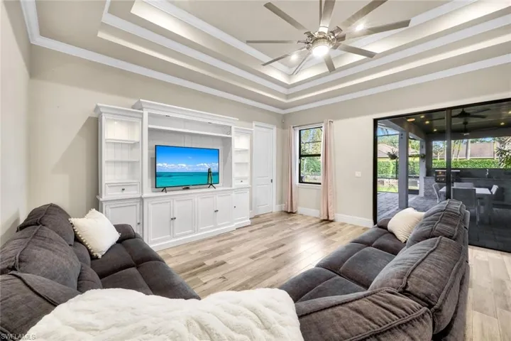Sliding doors adjoin indoor/outdoor spaces. There are hurricane shutters and impact resistant glass on all patio doors.