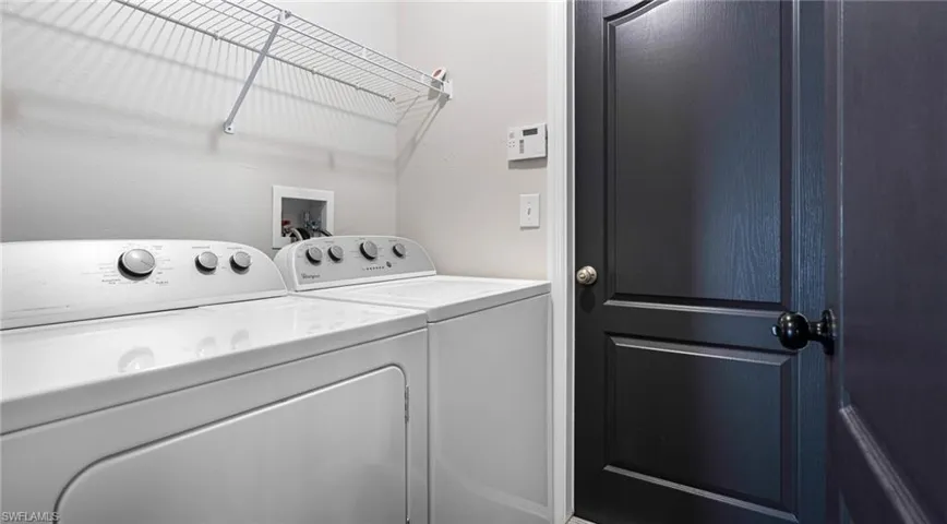 Laundry room  with washing machine and clothes dryer