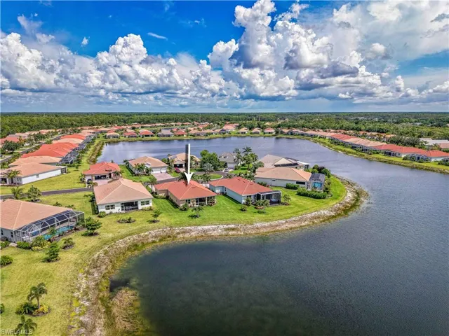 Aerial perspective of suburban area with a nearby body of water
