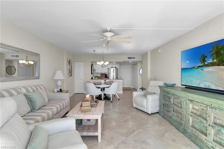 Living area with hanging lights and ceiling fan