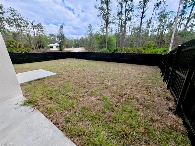 View of fenced backyard