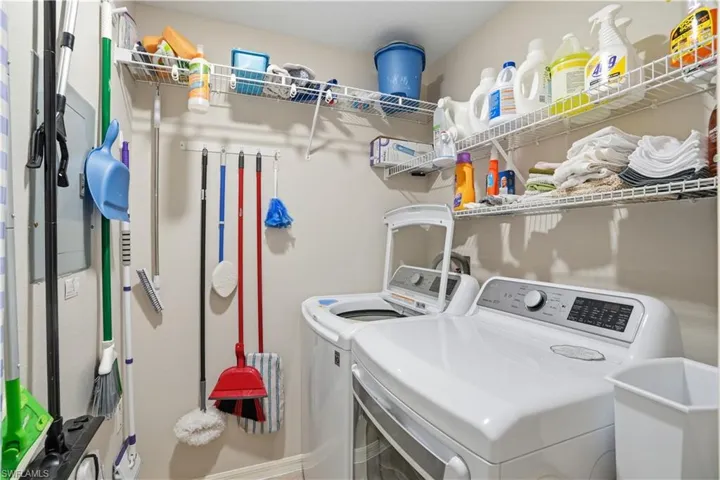 Laundry area with washing machine and clothes dryer