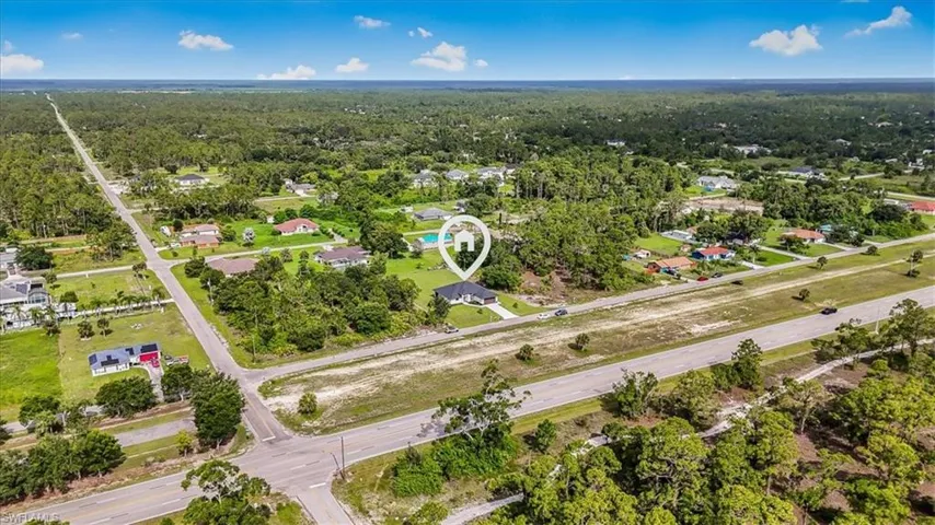 Aerial overview of property's location featuring a forest