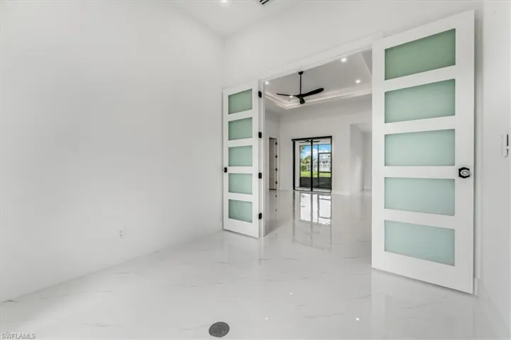 Spare room featuring marble tiled floors