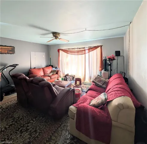 Living room featuring ceiling fan