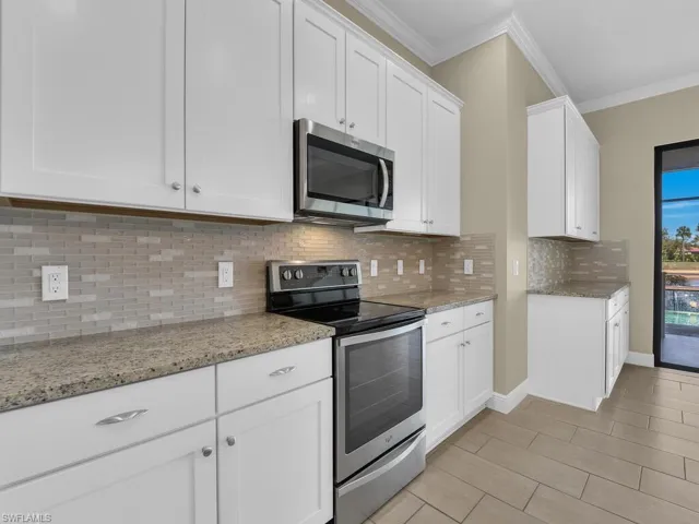 Designer Cabinetry & Glass Tile Backsplash
