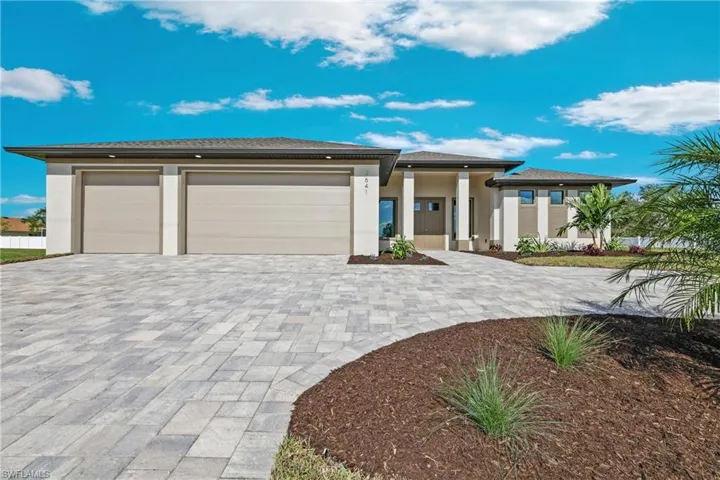 Prairie-style home featuring a garage