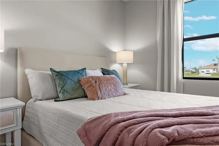 Bedroom featuring multiple windows