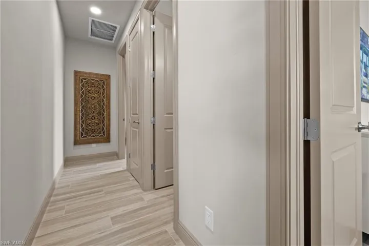 Corridor featuring light hardwood / wood-style floors