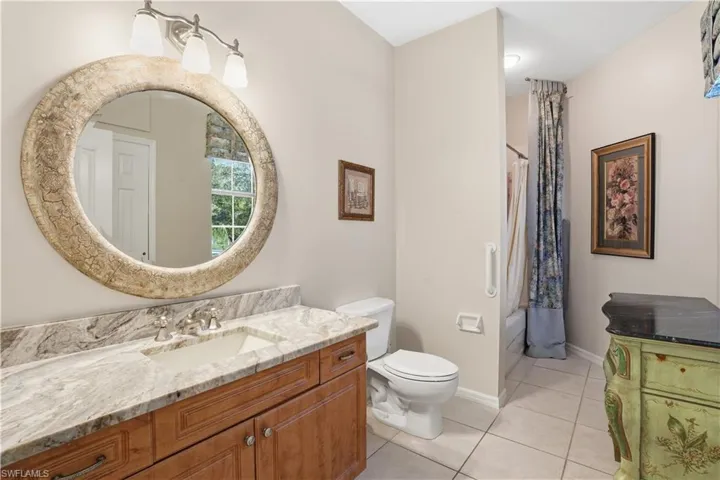Guest bathroom with tub/shower combination.