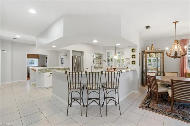 The breakfast bar serves as a casual dining spot.