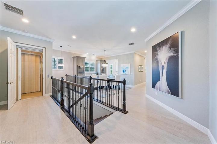 Foyer with private Elevator and custom railing and spindles