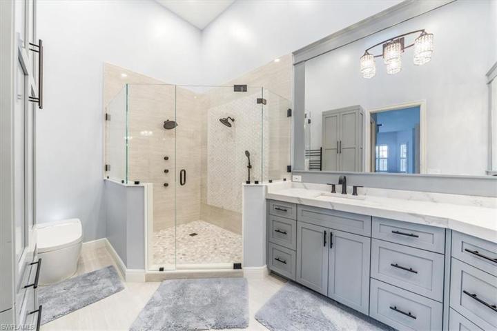 Custom Tile with 4 valve shower, and Toto Toilet
