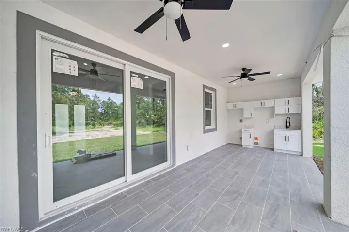 View of patio / terrace with sink and ceiling fan