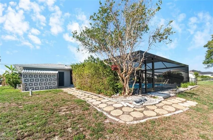 View of backyard, and pool enclosure