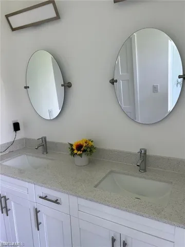Full bathroom with double vanity