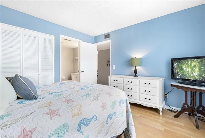 Bedroom featuring a closet and light hardwood / wood-style flooring