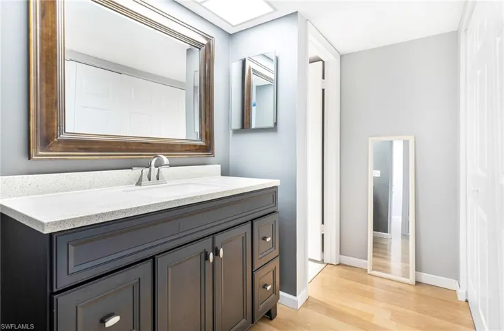 Bathroom featuring vanity and hardwood / wood-style flooring
