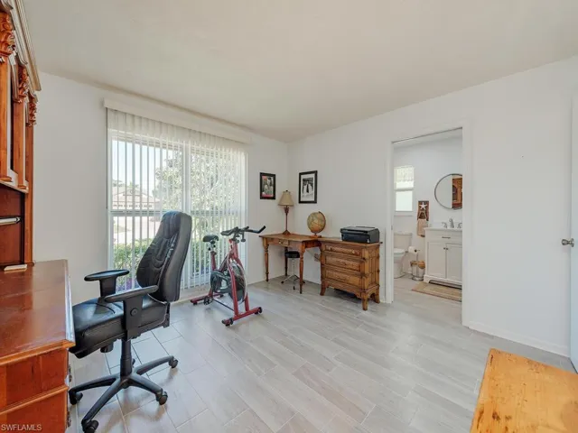 Office with baseboards and a sink