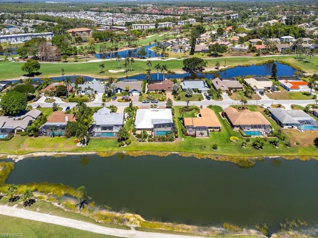 Aerial view with a water view and a residential view
