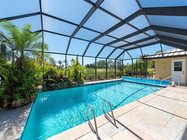 Outdoor pool with a patio and a lanai