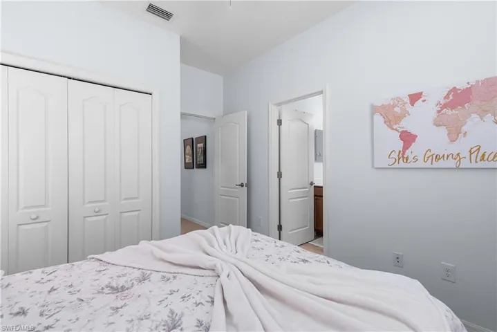 Bedroom featuring a closet and connected bathroom