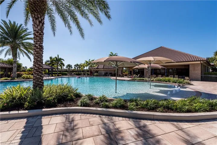 Community pool with a patio area