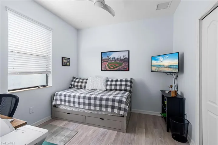 Bedroom featuring light wood-type flooring and ceiling fan
